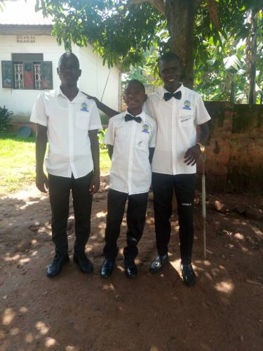 Ian, Amon und Wilson in Schuluniform